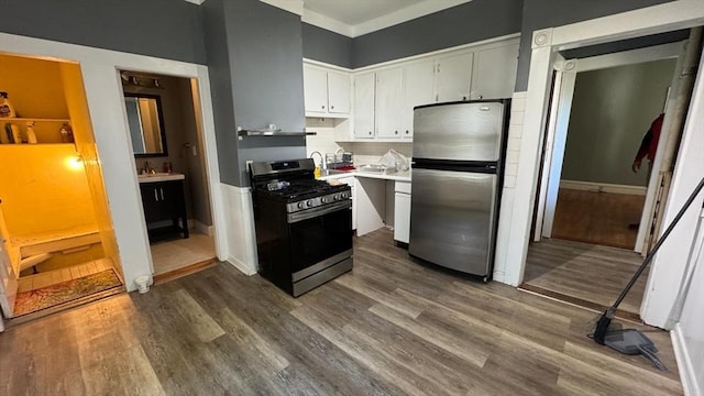486-488 E Merrimack St, Lowell, MA 01852 - kitchen featuring stainless steel appliances, dark wood-style floors, white cabinets, and a sink