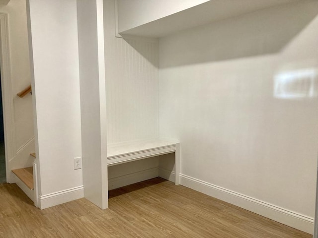 mudroom with light wood-type flooring and baseboards