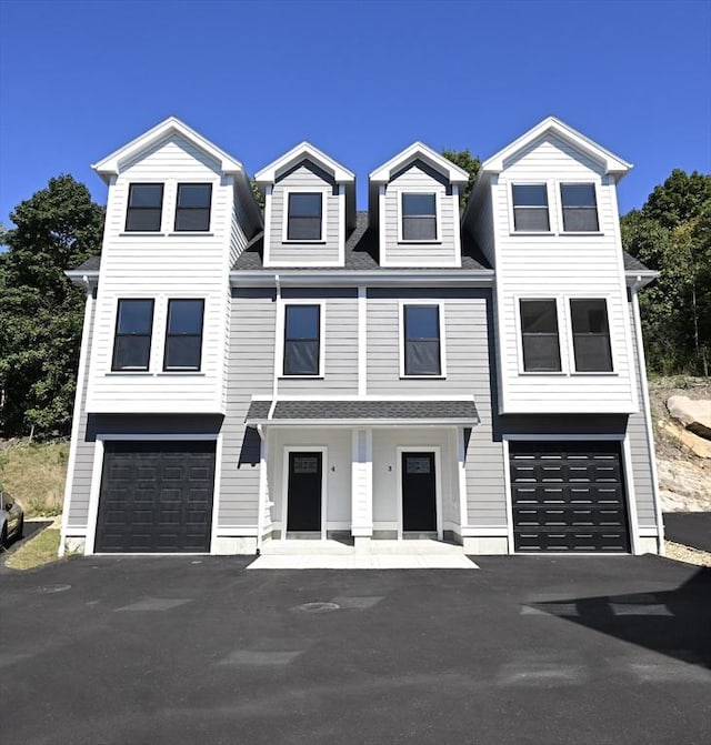 townhome / multi-family property featuring a garage