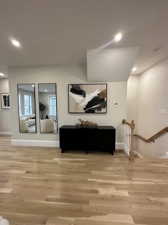 corridor featuring light hardwood / wood-style flooring