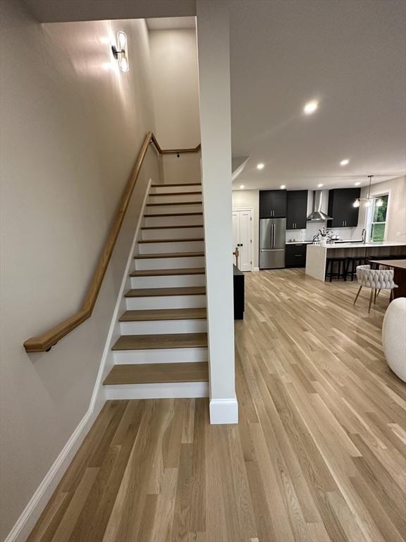 staircase featuring hardwood / wood-style flooring