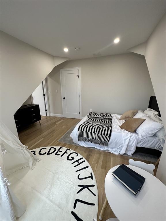 bedroom with hardwood / wood-style floors