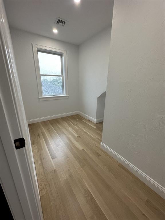 spare room featuring light wood-type flooring