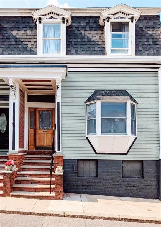 8 Story St, Boston, MA 02127 - view of exterior entry with mansard roof, roof with shingles, and a porch