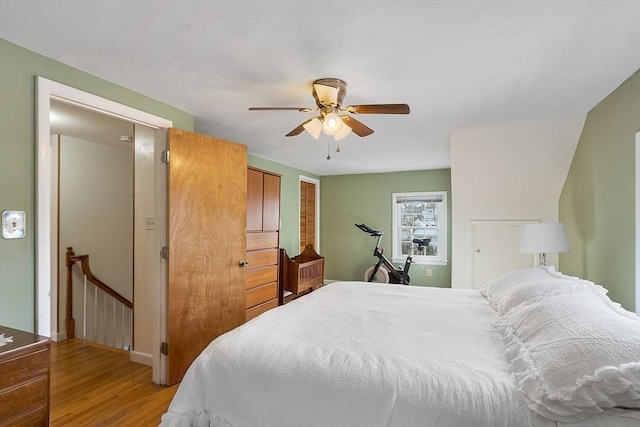 bedroom featuring hardwood / wood-style floors and ceiling fan