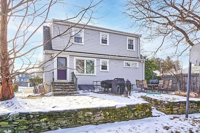 view of snow covered house