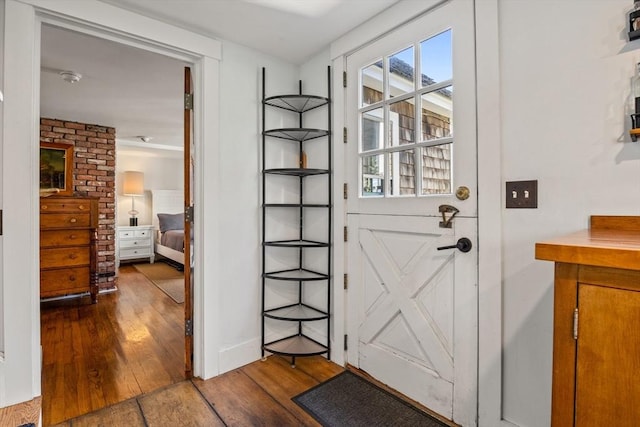 doorway to outside featuring hardwood / wood-style flooring