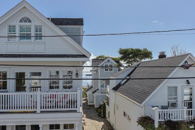 view of side of property featuring a balcony