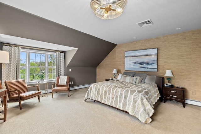 carpeted bedroom with a baseboard heating unit and vaulted ceiling