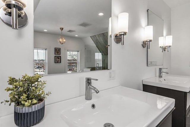 full bathroom with a stall shower, vanity, visible vents, and recessed lighting