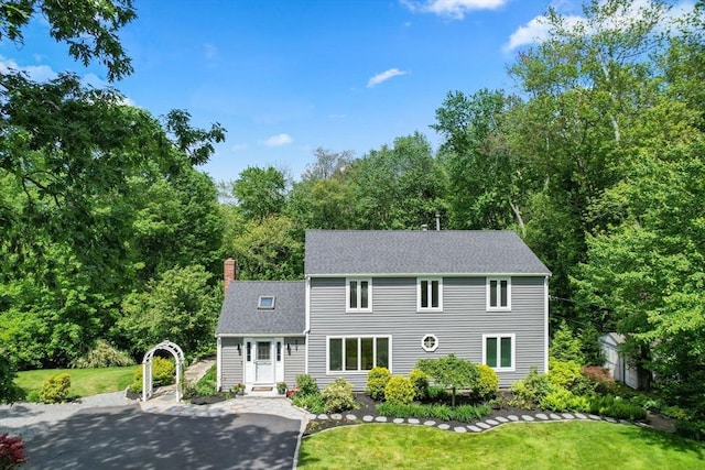 198 Edge Hill Rd, Sharon, MA 02067 - colonial inspired home featuring a chimney, a front yard, and roof with shingles