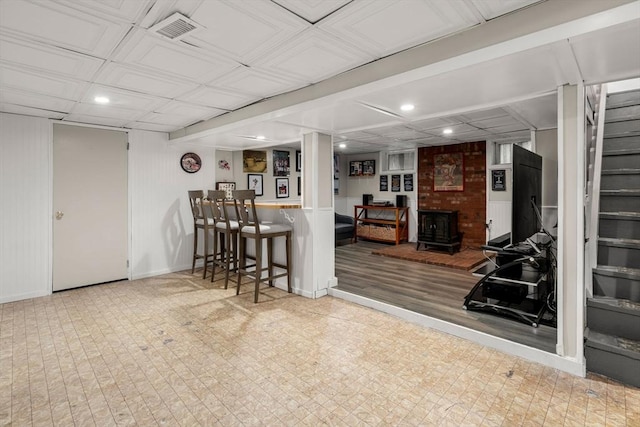 198 Edge Hill Rd, Sharon, MA 02067 - finished below grade area featuring a wood stove, recessed lighting, and stairway