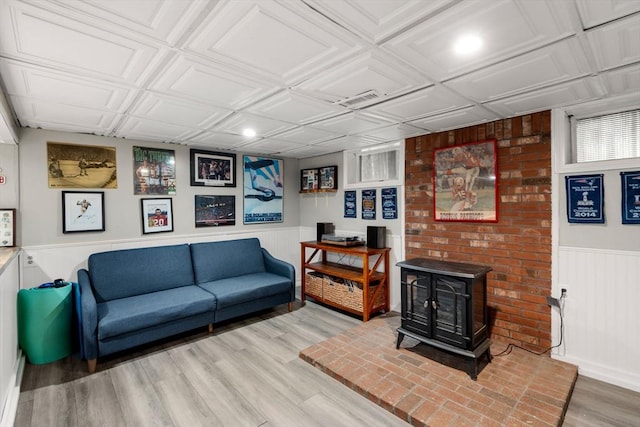 198 Edge Hill Rd, Sharon, MA 02067 - living room featuring a wainscoted wall, wood finished floors, an ornate ceiling, a wood stove, and recessed lighting