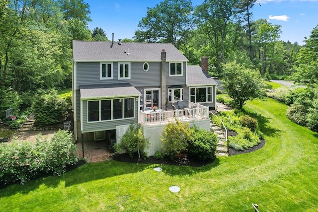 198 Edge Hill Rd, Sharon, MA 02067 - rear view of house with a chimney, a lawn, a deck, roof with shingles, and stairway