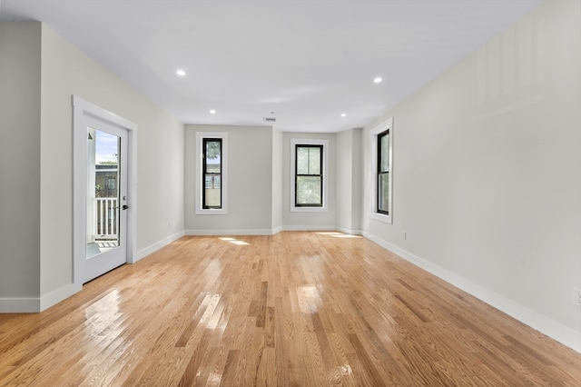 unfurnished room featuring light hardwood / wood-style floors