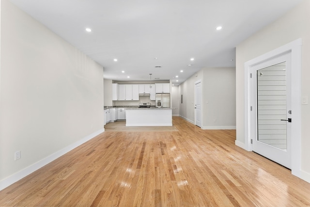 unfurnished living room featuring light hardwood / wood-style flooring