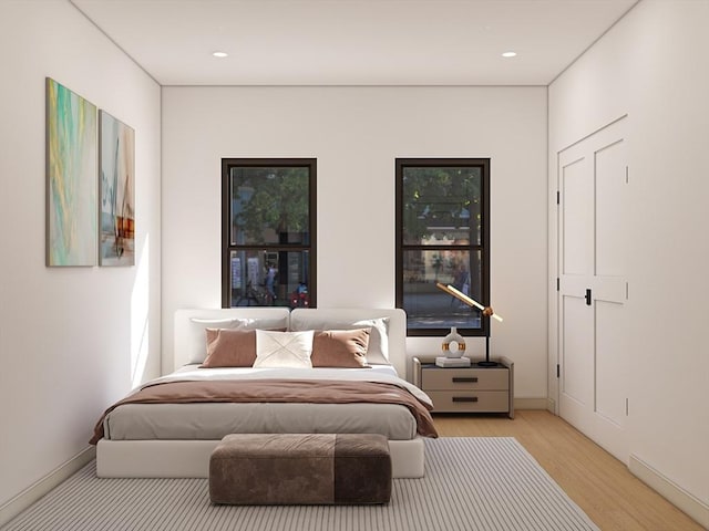 60 Stanley St Unit 102, Boston, MA 02125 - bedroom with wood finished floors, baseboards, and recessed lighting