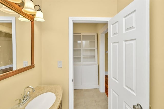 bathroom with tile patterned flooring and vanity