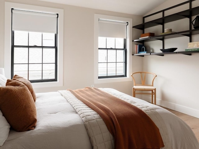 16 Plymouth St Unit 16, Arlington, MA 02476 - bedroom with wood finished floors and lofted ceiling