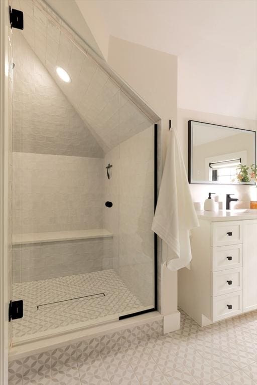 16 Plymouth St Unit 16, Arlington, MA 02476 - bathroom featuring vanity, a tile shower, and vaulted ceiling