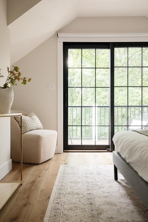 16 Plymouth St Unit 16, Arlington, MA 02476 - bedroom featuring lofted ceiling and wood finished floors