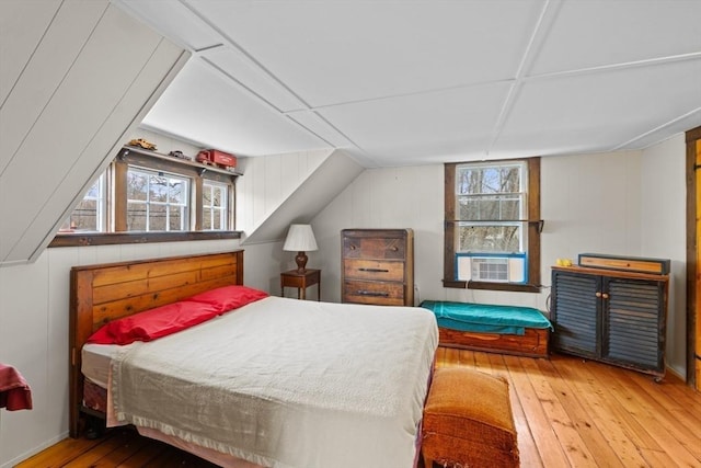 bedroom featuring hardwood / wood-style flooring and cooling unit