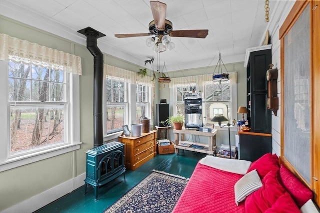 sunroom featuring a wood stove