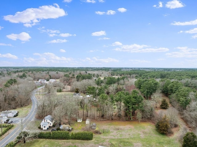 drone / aerial view featuring a forest view