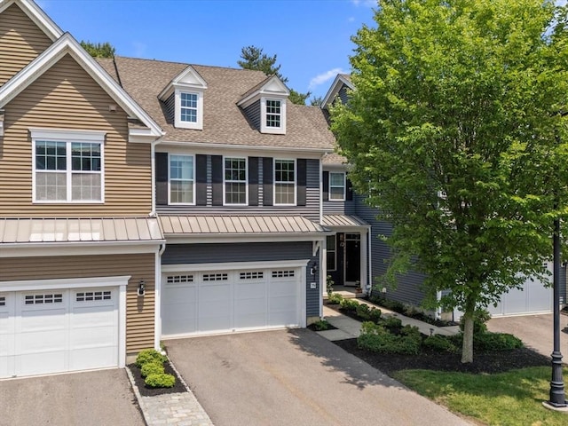 79 Townsend Blvd Unit 79, Westborough, MA 01581 - view of front of house featuring a standing seam roof, asphalt driveway, a shingled roof, an attached garage, and a metal roof