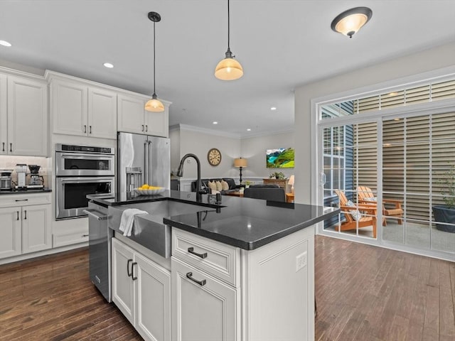 79 Townsend Blvd Unit 79, Westborough, MA 01581 - kitchen featuring stainless steel appliances, dark wood-style flooring, ornamental molding, hanging light fixtures, and white cabinets