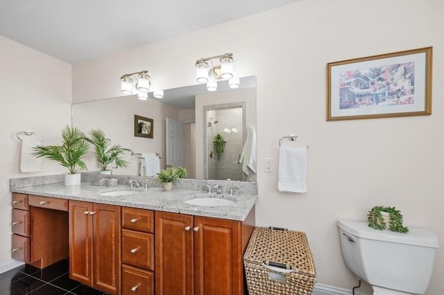 bathroom featuring vanity, tile patterned flooring, a shower, and toilet