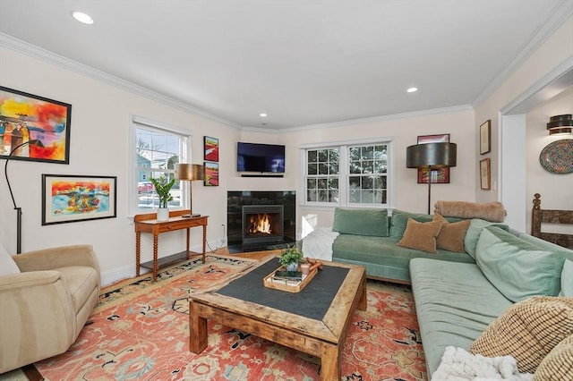 living room featuring crown molding and a fireplace