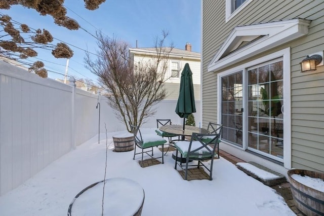 view of snow covered patio