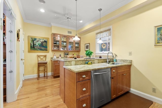 50 Telpgraph St, Boston, MA 02127 - kitchen featuring stainless steel dishwasher, a peninsula, brown cabinetry, glass insert cabinets, and light wood-style floors