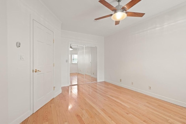 50 Telpgraph St, Boston, MA 02127 - unfurnished bedroom featuring light wood finished floors, a closet, crown molding, and a ceiling fan