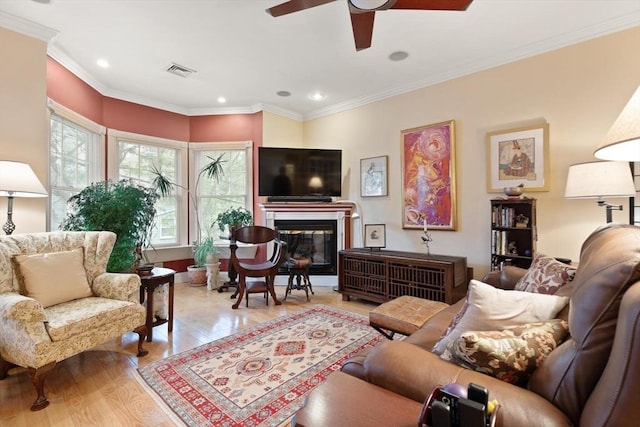 50 Telpgraph St, Boston, MA 02127 - living area featuring wood finished floors, a ceiling fan, a glass covered fireplace, recessed lighting, and crown molding