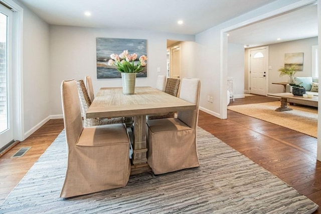 dining area featuring hardwood / wood-style floors