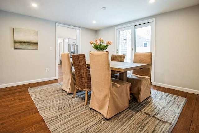 dining room with hardwood / wood-style flooring