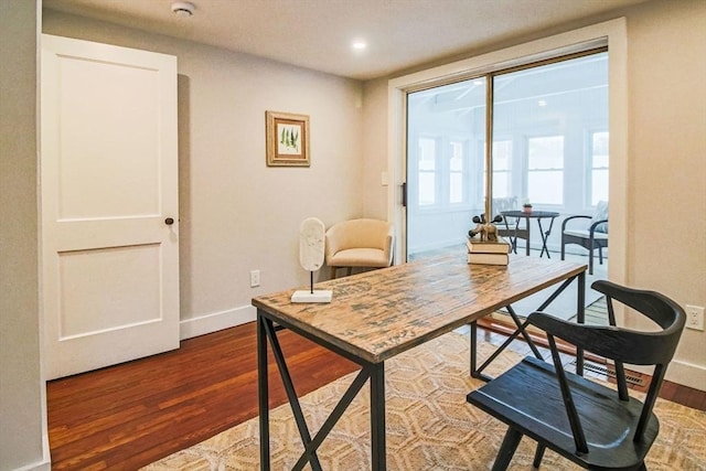 dining area with hardwood / wood-style floors