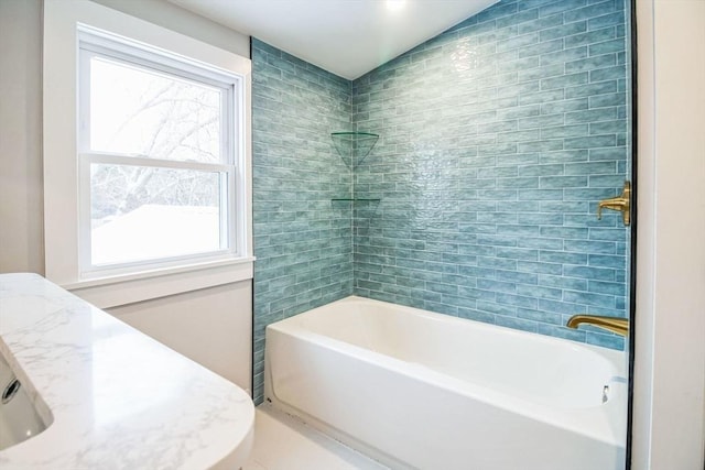 bathroom featuring shower / bath combination and lofted ceiling