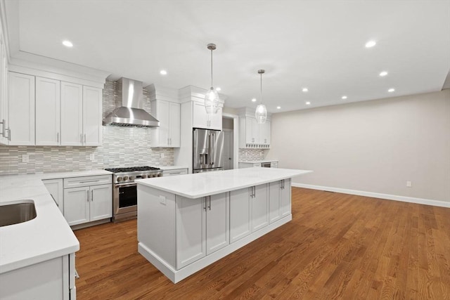 11 Olde Stable Ln, Easton, MA 02356 - kitchen with wall chimney exhaust hood, appliances with stainless steel finishes, a center island, decorative backsplash, and light countertops