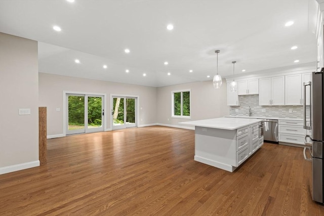 11 Olde Stable Ln, Easton, MA 02356 - kitchen with stainless steel appliances, a kitchen island, white cabinets, dark wood-style floors, and recessed lighting