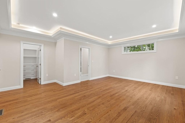 11 Olde Stable Ln, Easton, MA 02356 - empty room featuring a tray ceiling, light wood-style flooring, recessed lighting, and ornamental molding