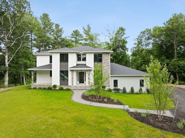 11 Olde Stable Ln, Easton, MA 02356 - view of front of property featuring a front lawn, stucco siding, and a shingled roof