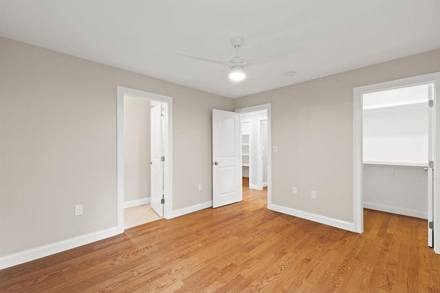 11 Olde Stable Ln, Easton, MA 02356 - unfurnished bedroom with a spacious closet, light wood-type flooring, a closet, and ceiling fan