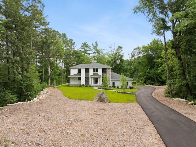 11 Olde Stable Ln, Easton, MA 02356 - view of front of house with a front yard, asphalt driveway, and a wooded view