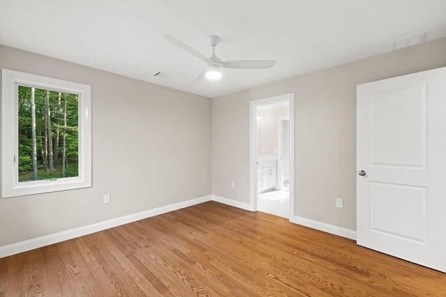 11 Olde Stable Ln, Easton, MA 02356 - unfurnished bedroom with light wood finished floors, ensuite bath, and a ceiling fan