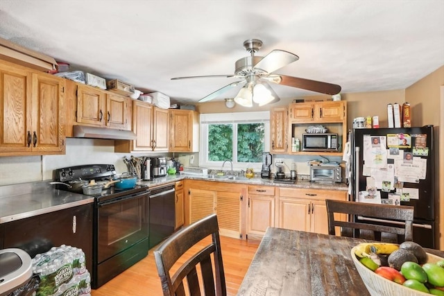 kitchen with ceiling fan, sink, light brown cabinets, light hardwood / wood-style floors, and black appliances