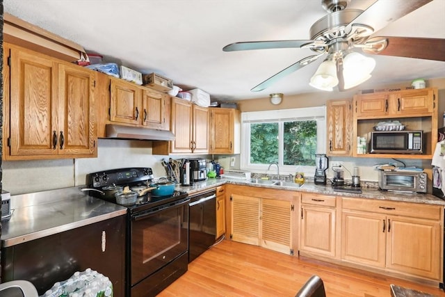 kitchen featuring ceiling fan, sink, light stone counters, light hardwood / wood-style floors, and black appliances