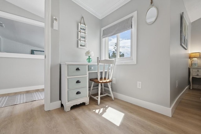 office space with crown molding, baseboards, and wood finished floors
